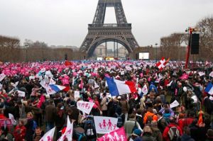 Thousands of demonstrators gather on the Champ de Mars near the Eiffel Tower in Paris